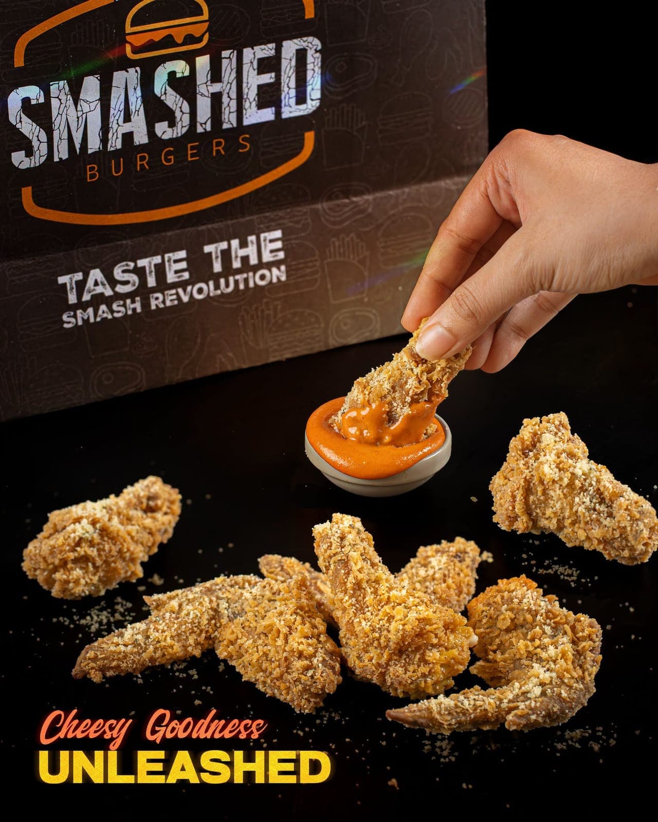 Parmesan wing being dipped in sauce