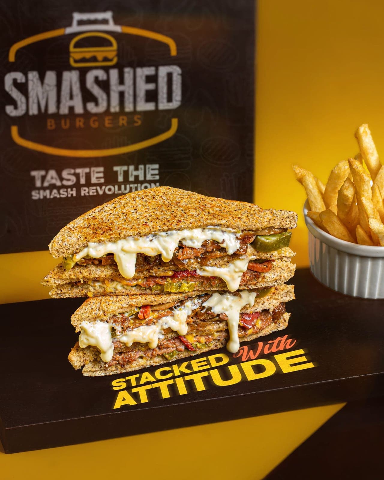 Smashed beef sandwich stacked high with sauce